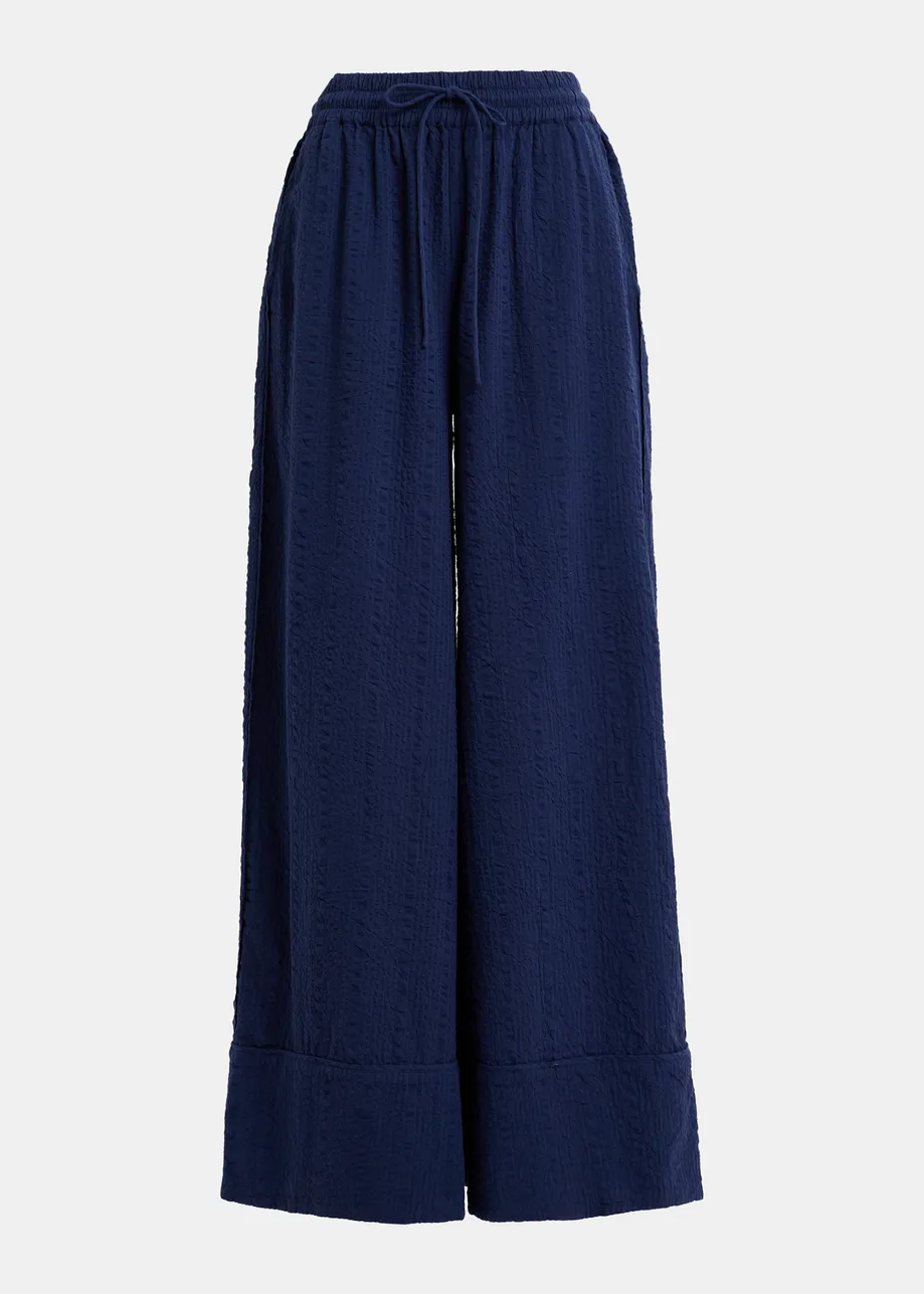 Pantaloni larghi blu scuro con cuciture a contrasto