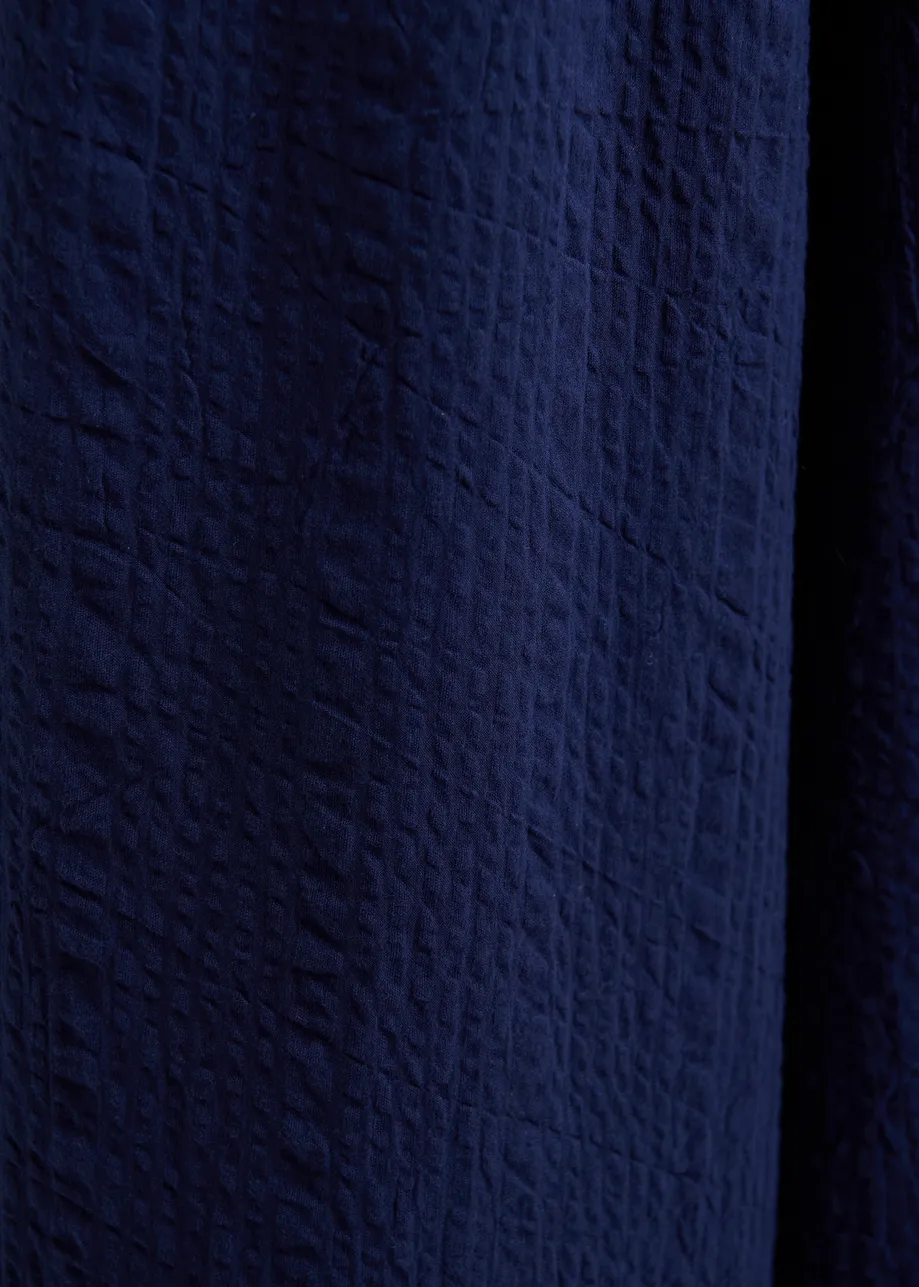 Pantaloni larghi blu scuro con cuciture a contrasto