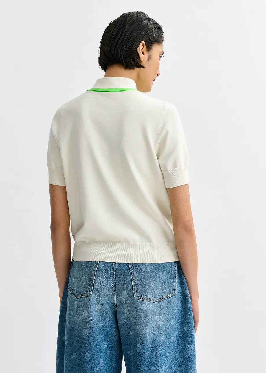 Off-white fine-knit polo with light green scarf-like contrast collar