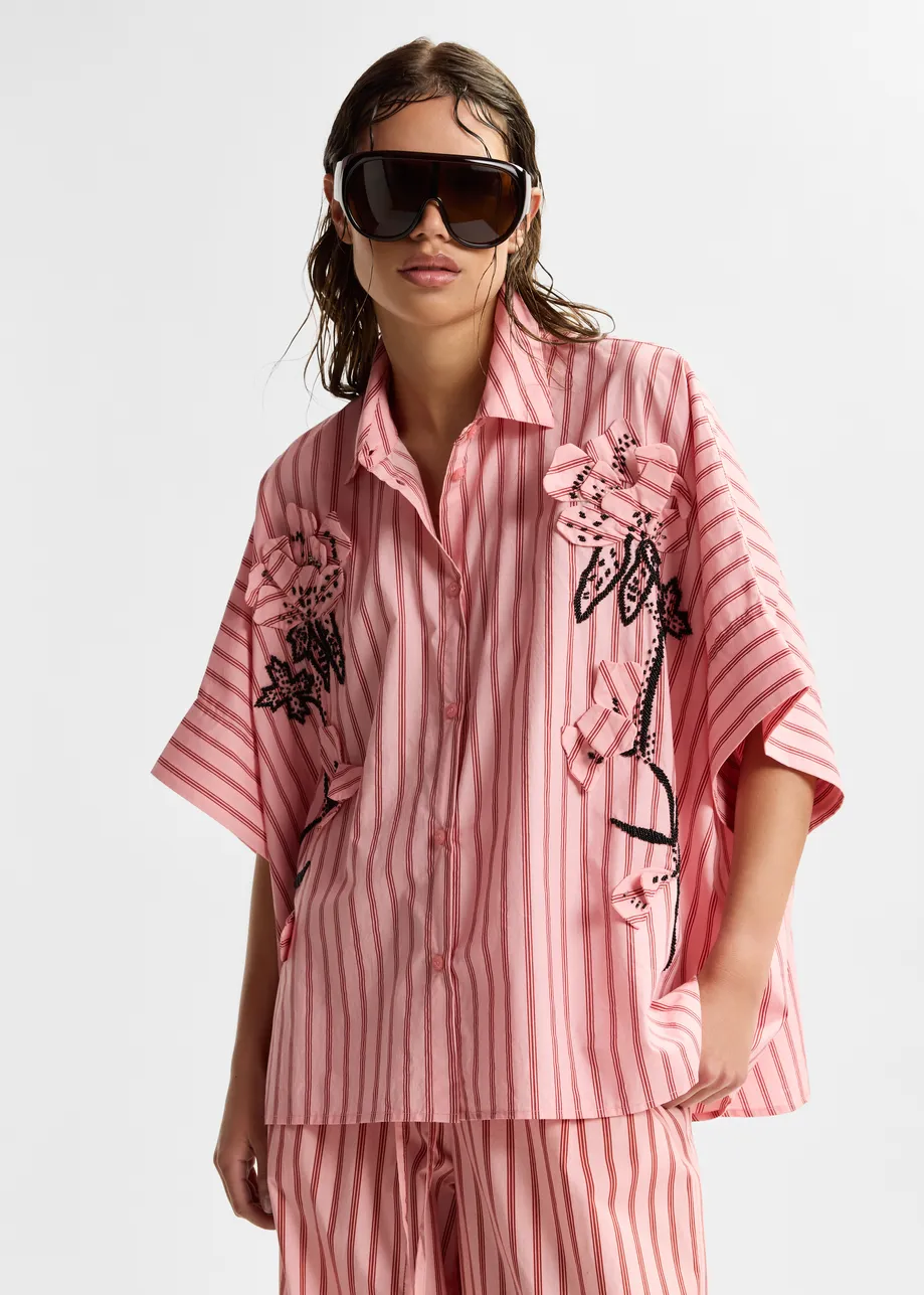 Pink and red oversized cotton shirt with floral appliqué embroidery and bead embellishments