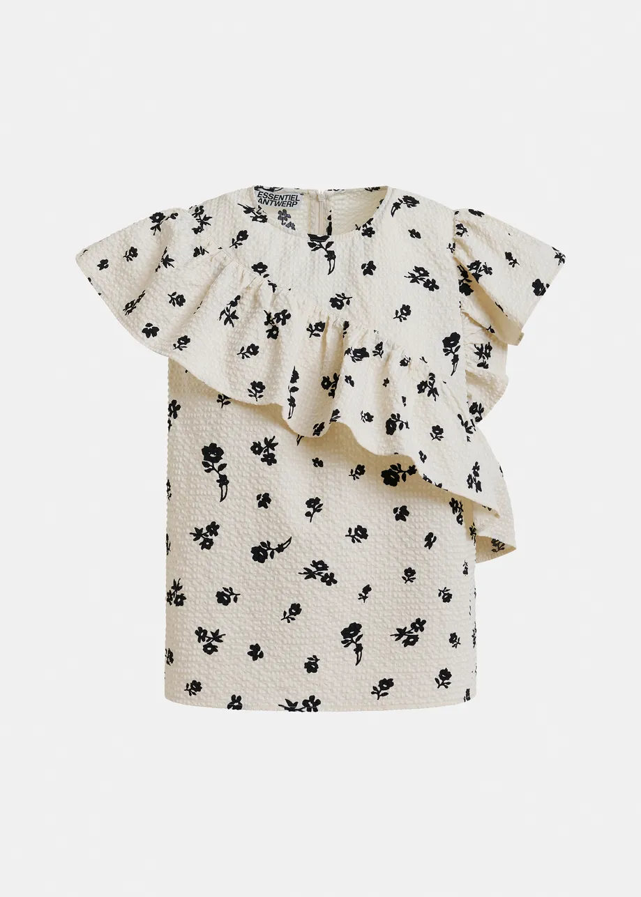 Off-white and black asymmetrical top with ruffle details