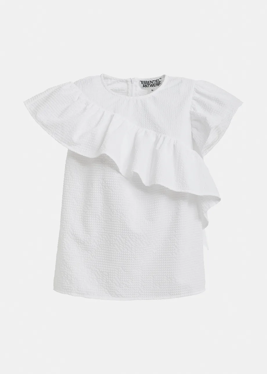 White asymmetrical top with ruffle details