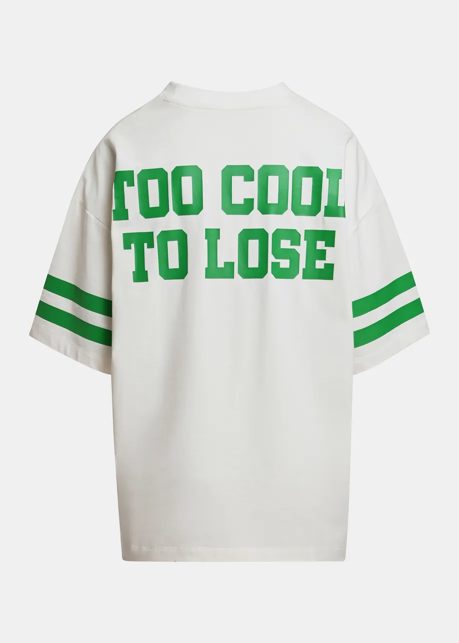 Off-white T-shirt with Peanuts™ Snoopy print and green text