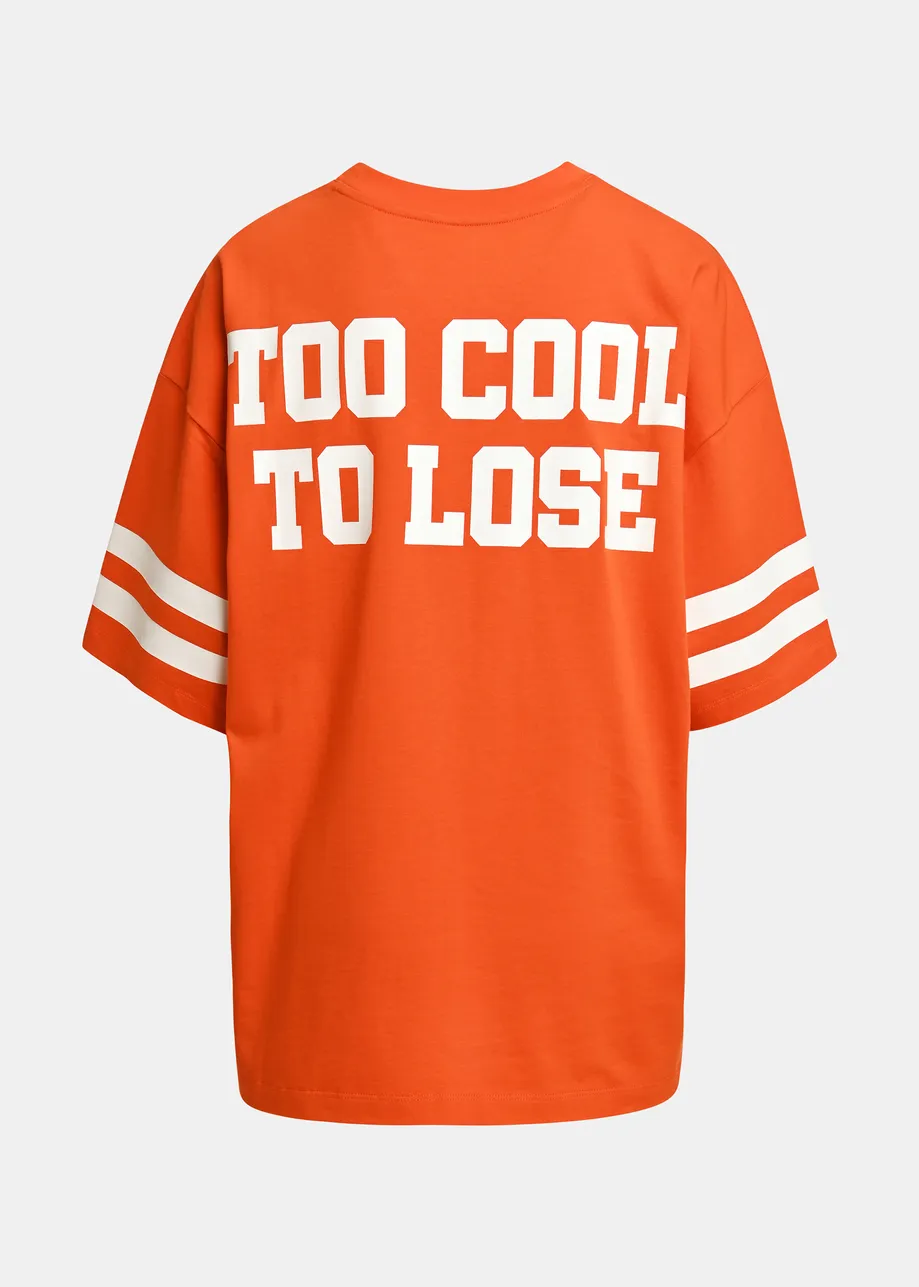 Orange T-shirt with Peanuts™ Snoopy print and white text