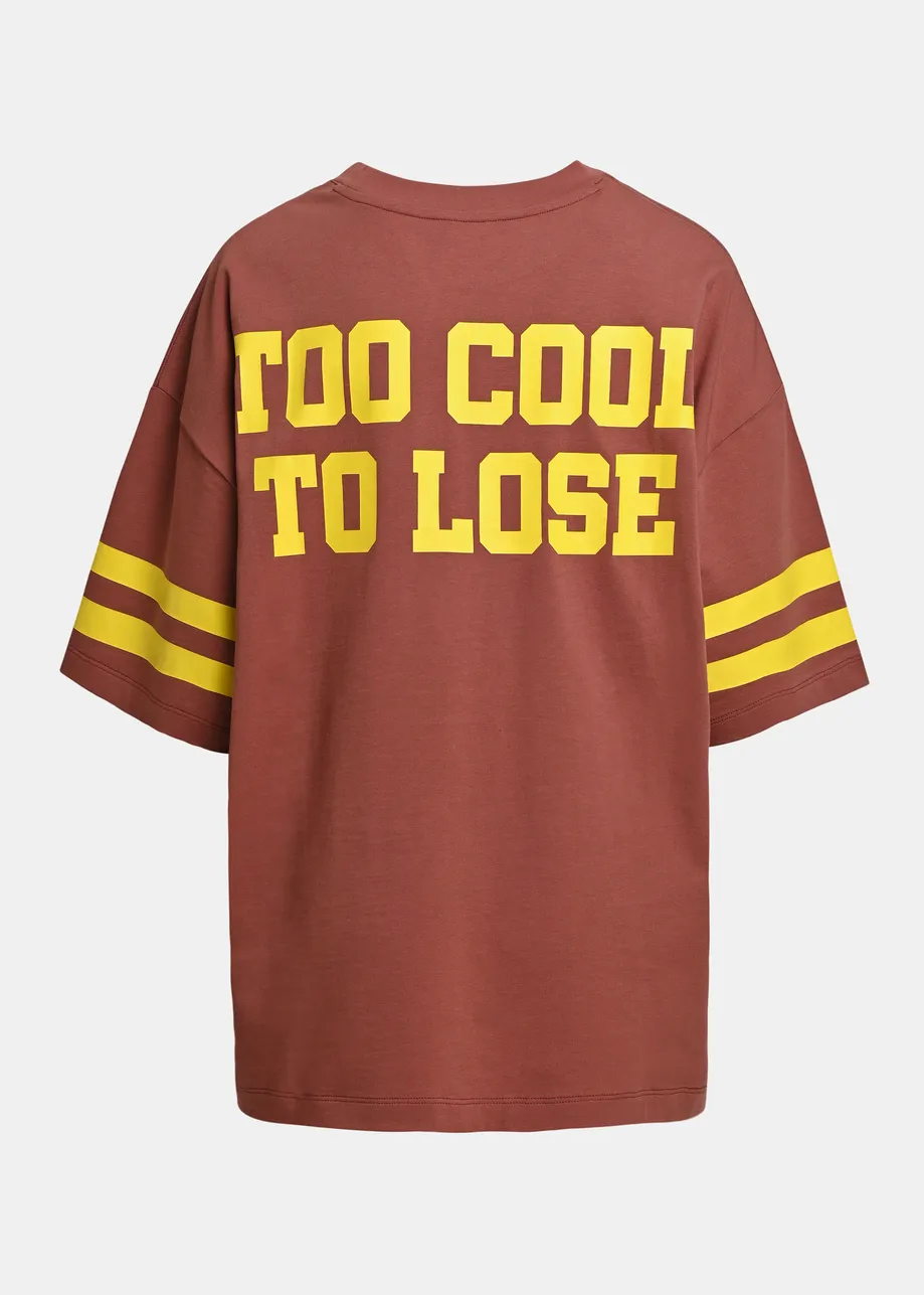 Brown T-shirt with Peanuts™ Snoopy print and yellow text