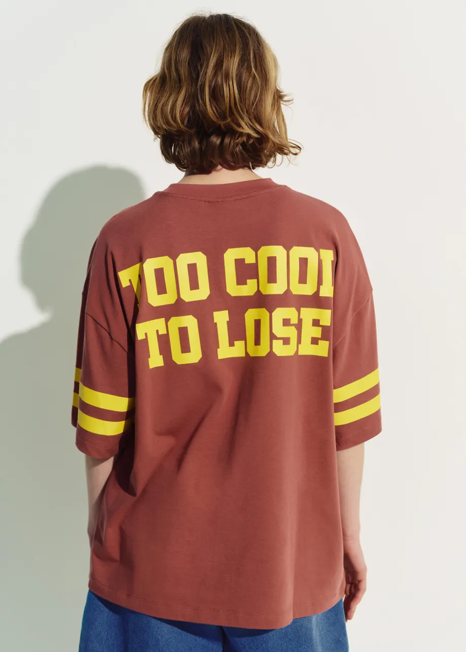 Brown T-shirt with Peanuts™ Snoopy print and yellow text