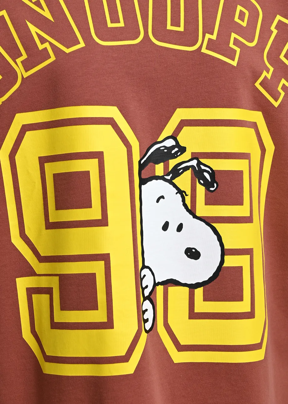 Brown T-shirt with Peanuts™ Snoopy print and yellow text