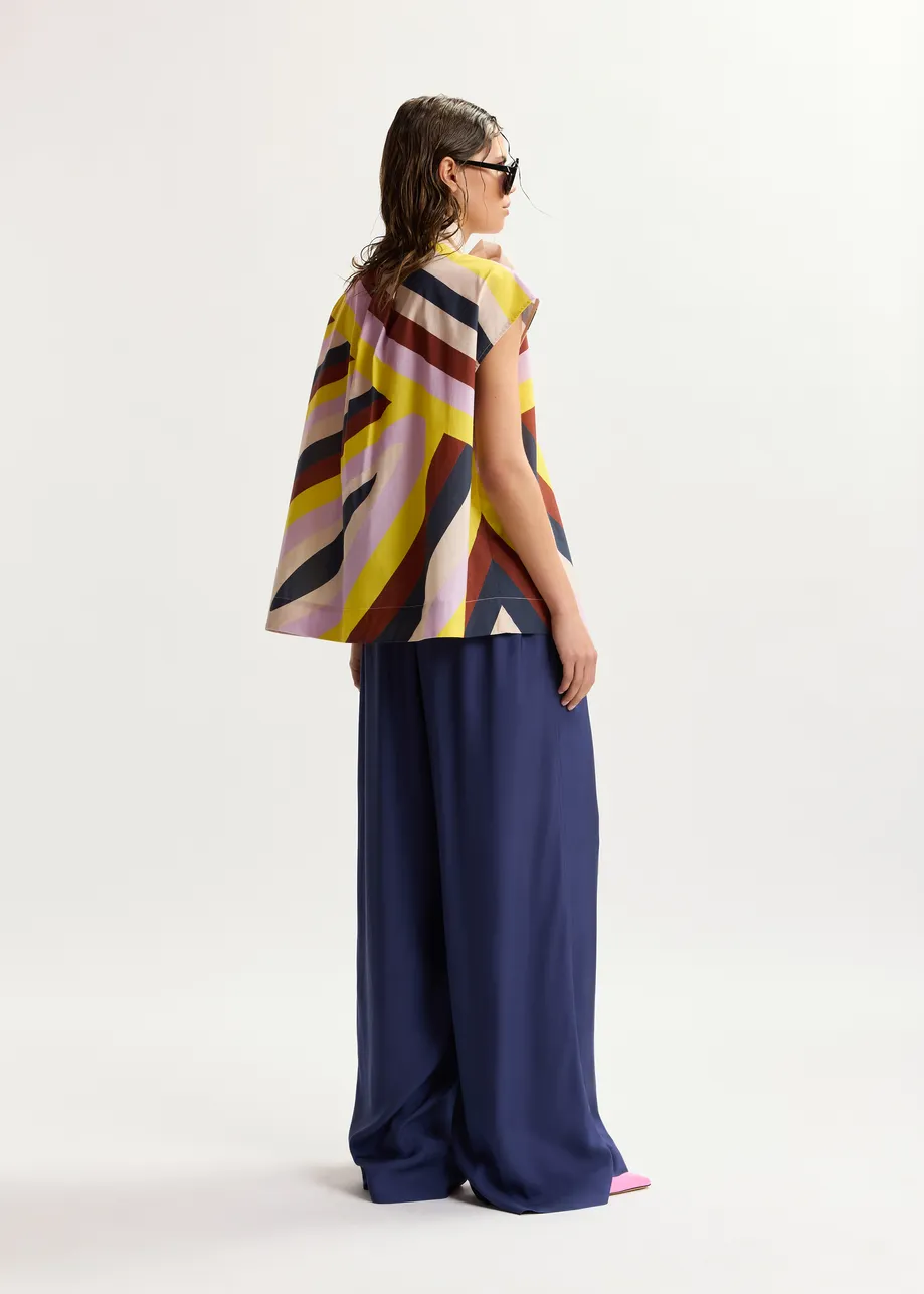 Maglia senza maniche con stampa grafica multicolor in color crema e scollo a fiocco