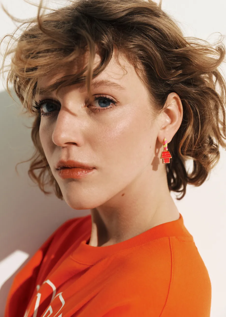 Pink and yellow hoop earrings with Snoopy and doghouse