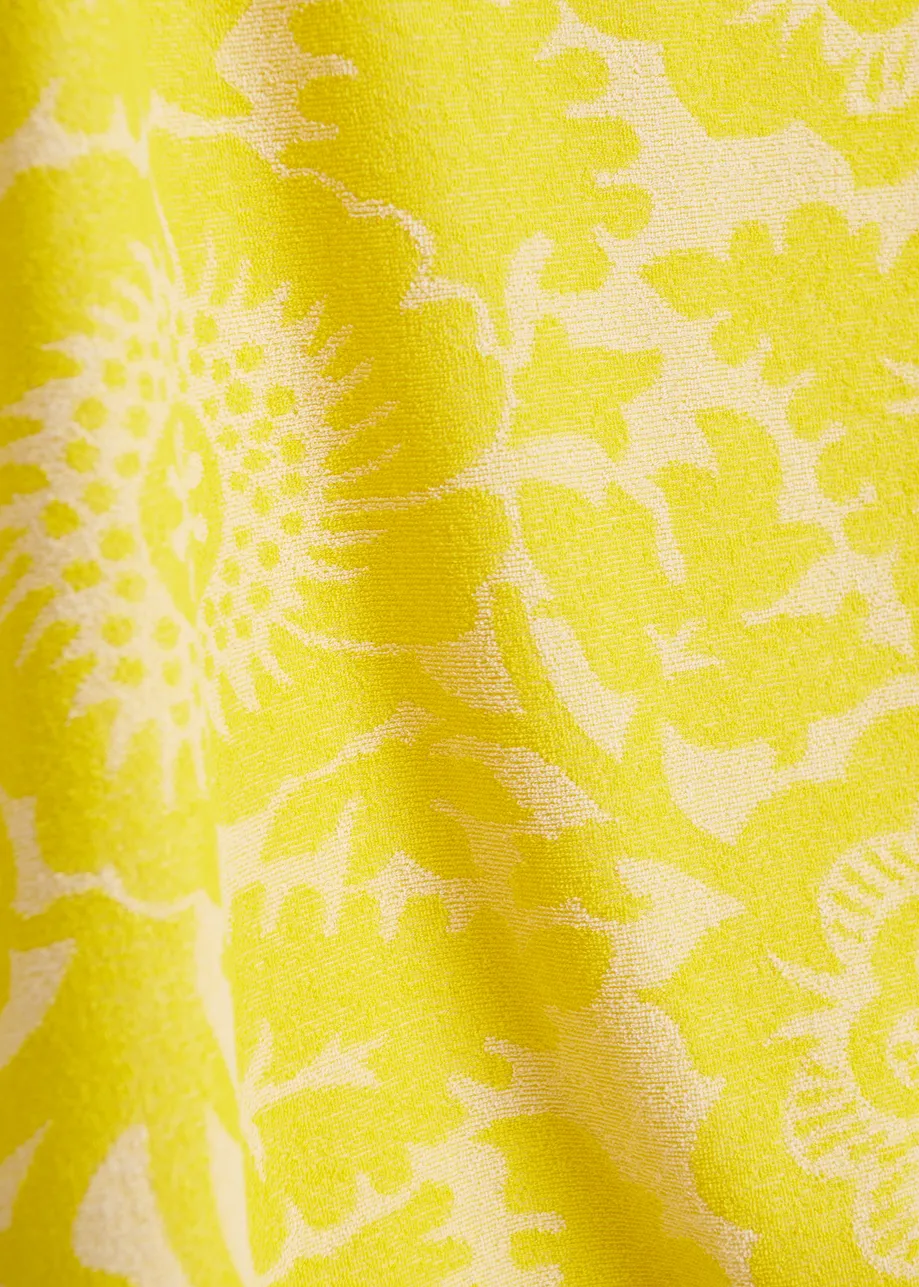 Maglia in misto cotone jacquard con motivo floreale giallo testurizzato e frange