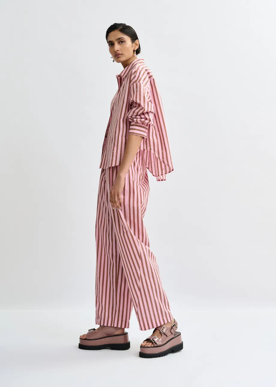 Pink and brown striped tapered-leg pants with rhinestone embellishments
