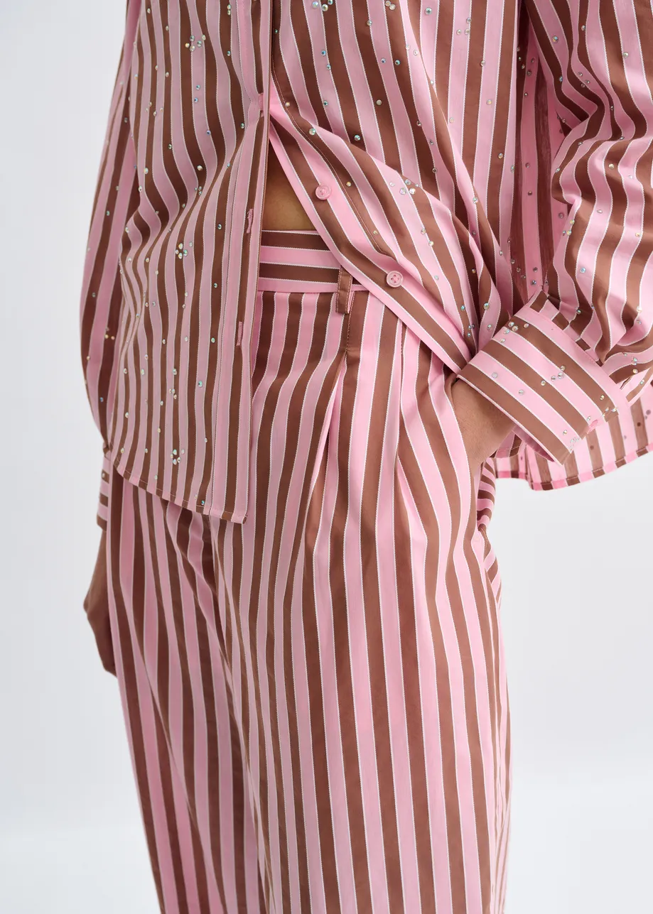 Pink and brown striped tapered-leg pants with rhinestone embellishments