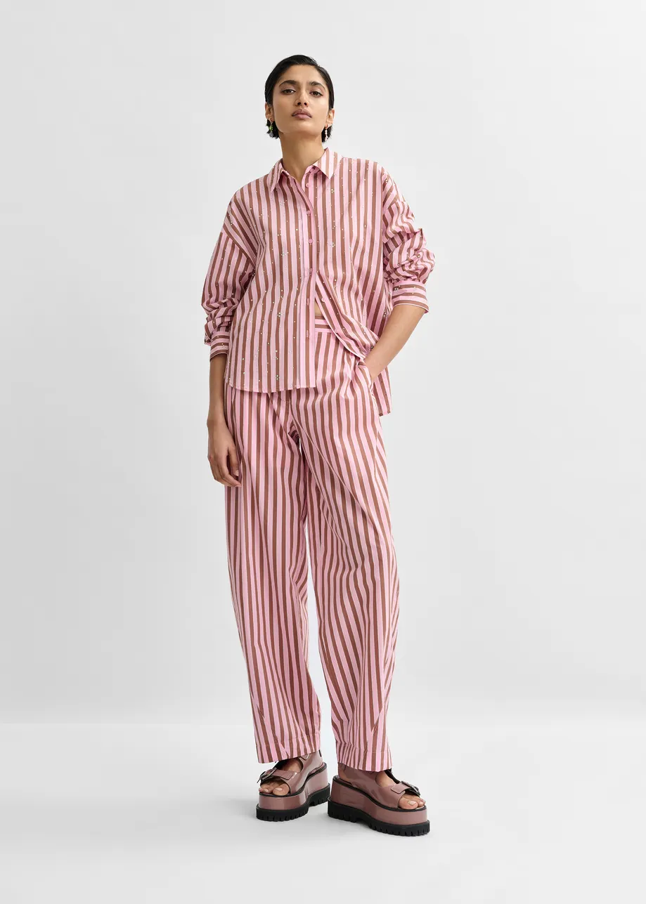 Pink and brown striped tapered-leg pants with rhinestone embellishments