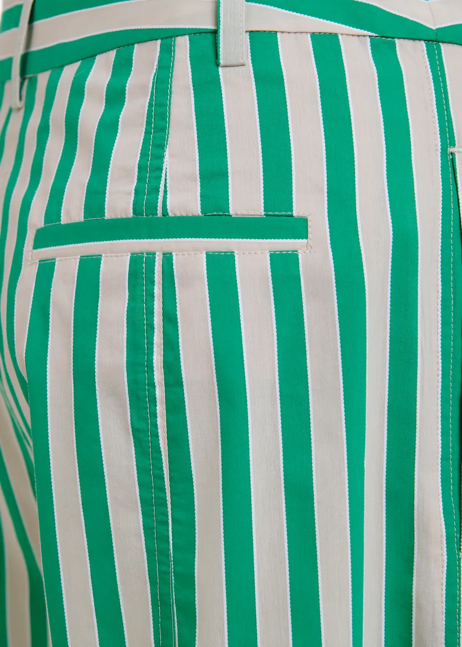 Green and cream striped tapered-leg pants with rhinestone embellishments