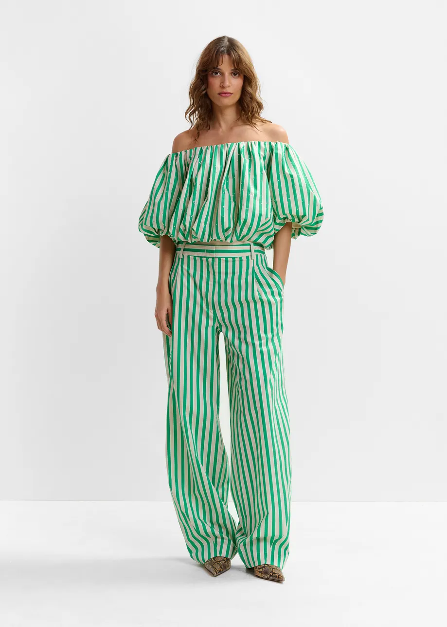 Green and cream striped tapered-leg pants with rhinestone embellishments