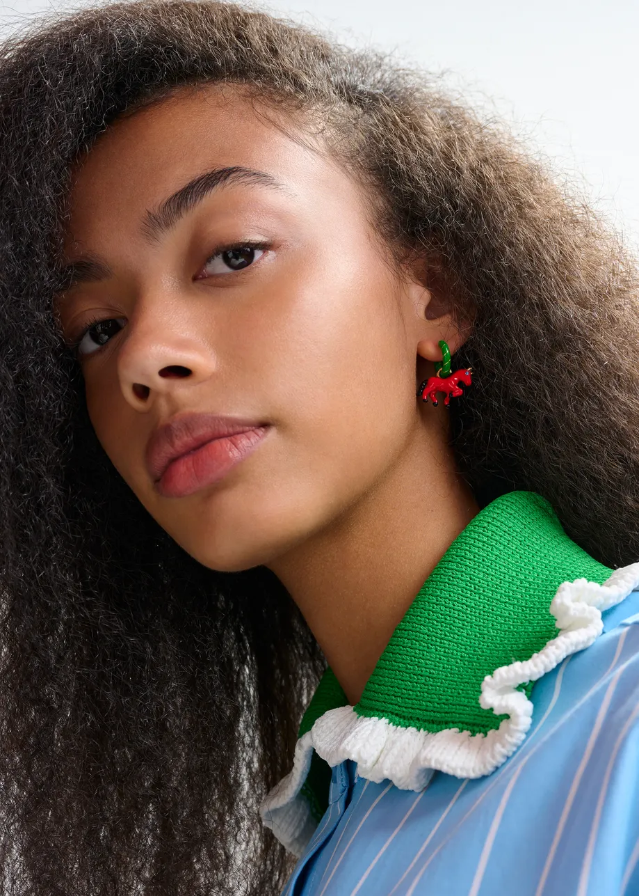 Green and gold hoop earrings with horse and boy pendants