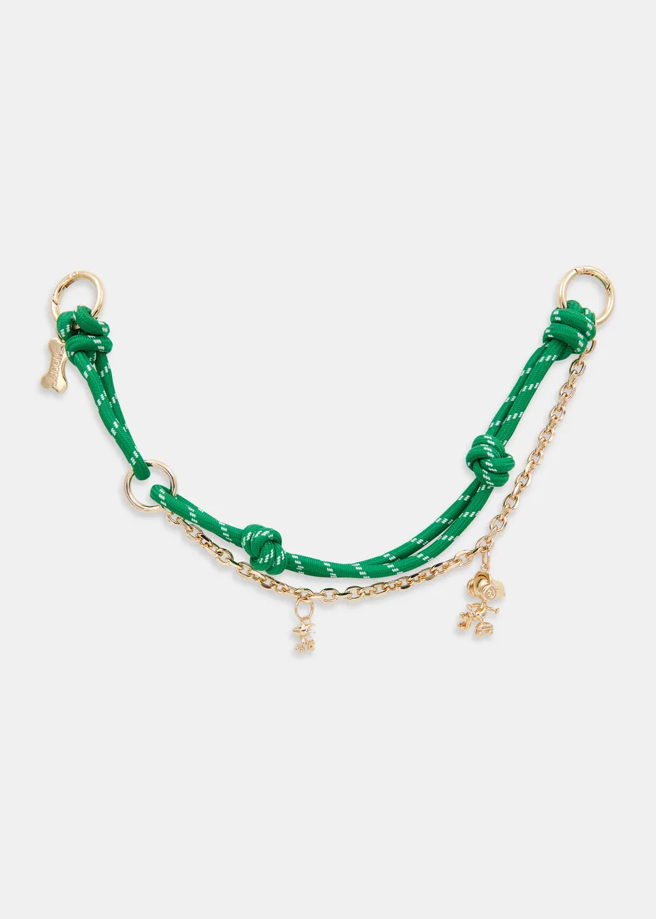 Green and gold-tone Peanuts™ Snoopy and Woodstock bag charm