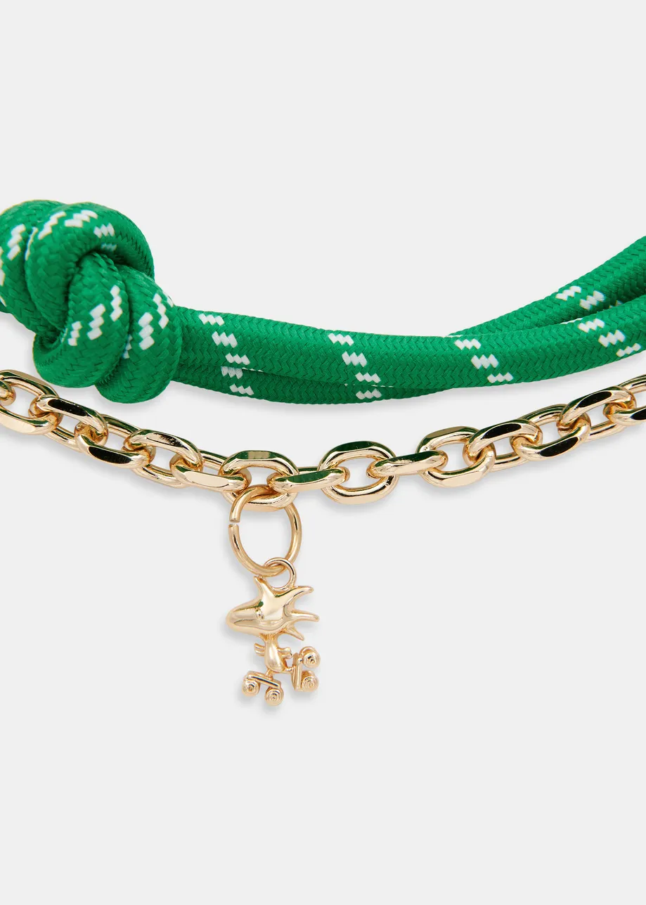 Green and gold-tone Peanuts™ Snoopy and Woodstock bag charm