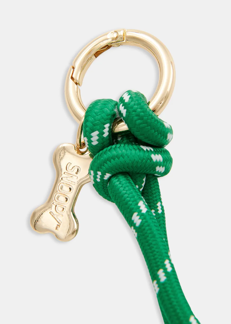 Green and gold-tone Peanuts™ Snoopy and Woodstock bag charm