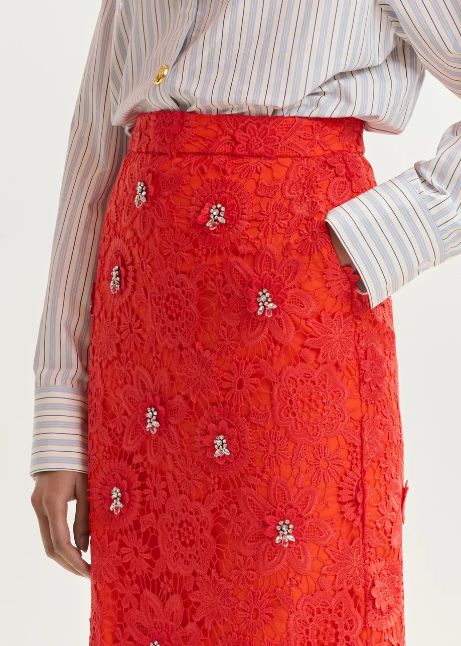 Oranje kokerrok in bloemenkant met stras