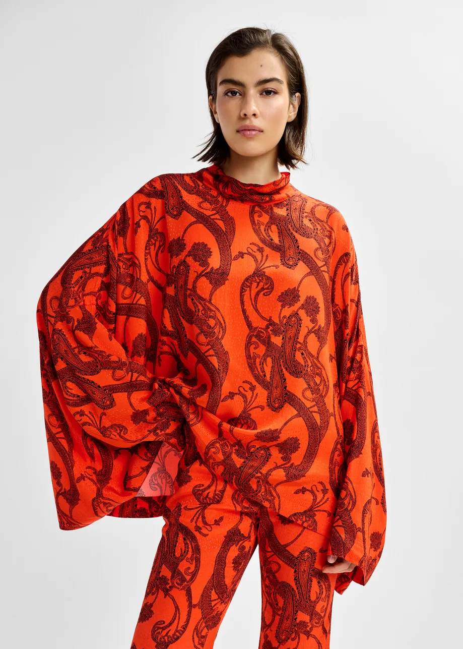 Oranje en zwarte oversized top met hoge halslijn en paisleyprint