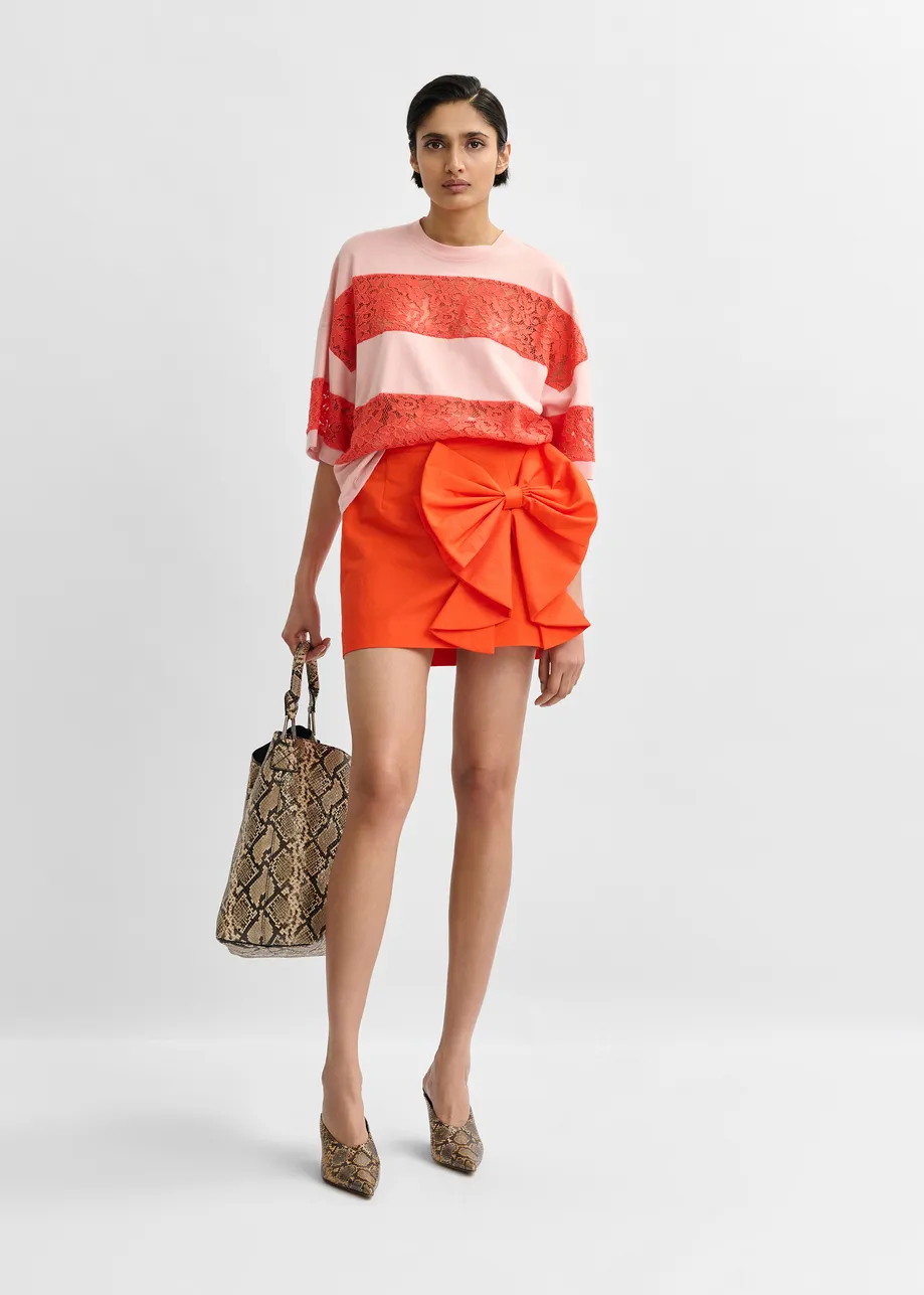 Red cotton-blend mini skirt with appliquéd bow