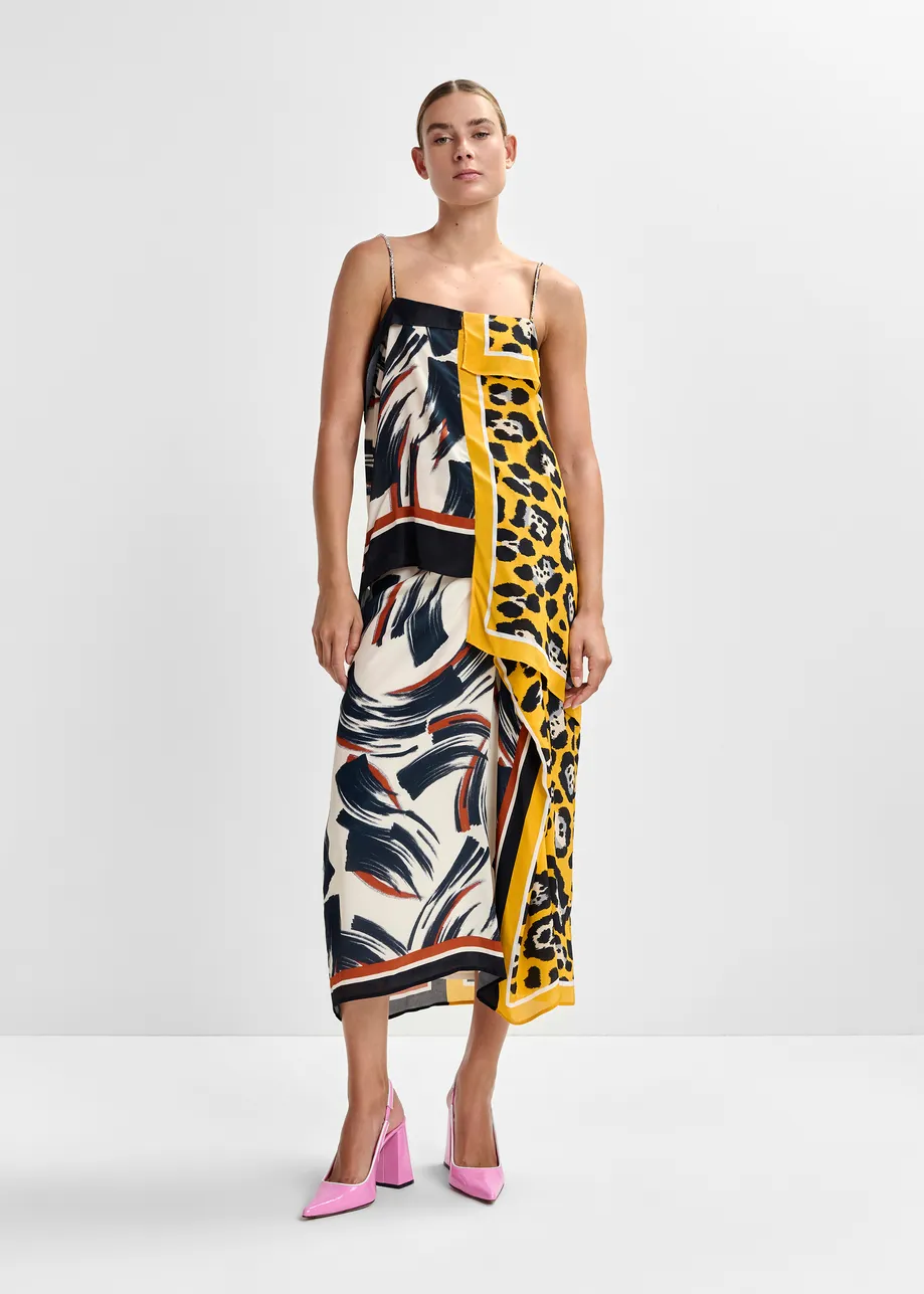 Jupe mi-longue drapée à imprimé multicolore