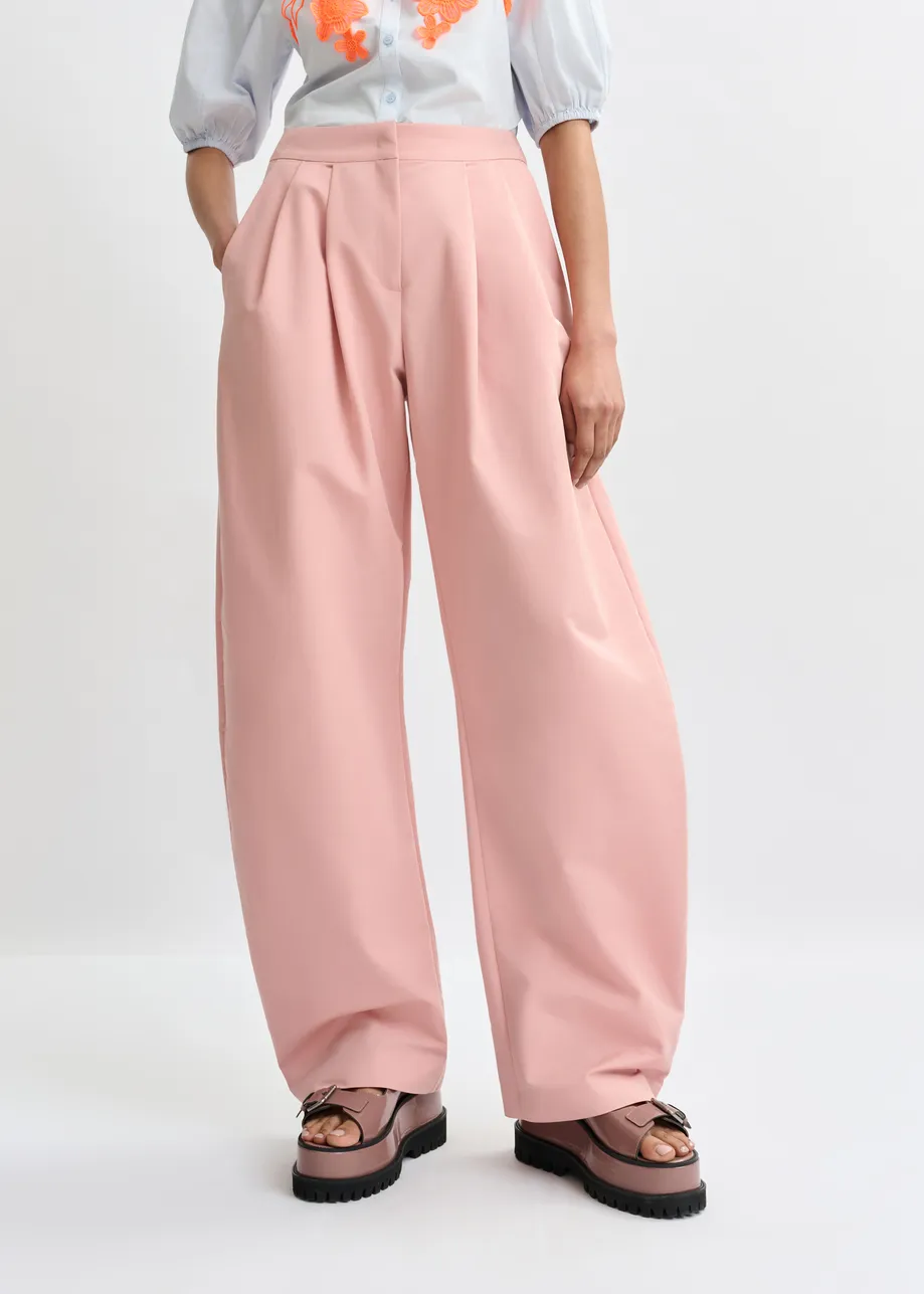 Light pink barrel-leg pants with pleated waist