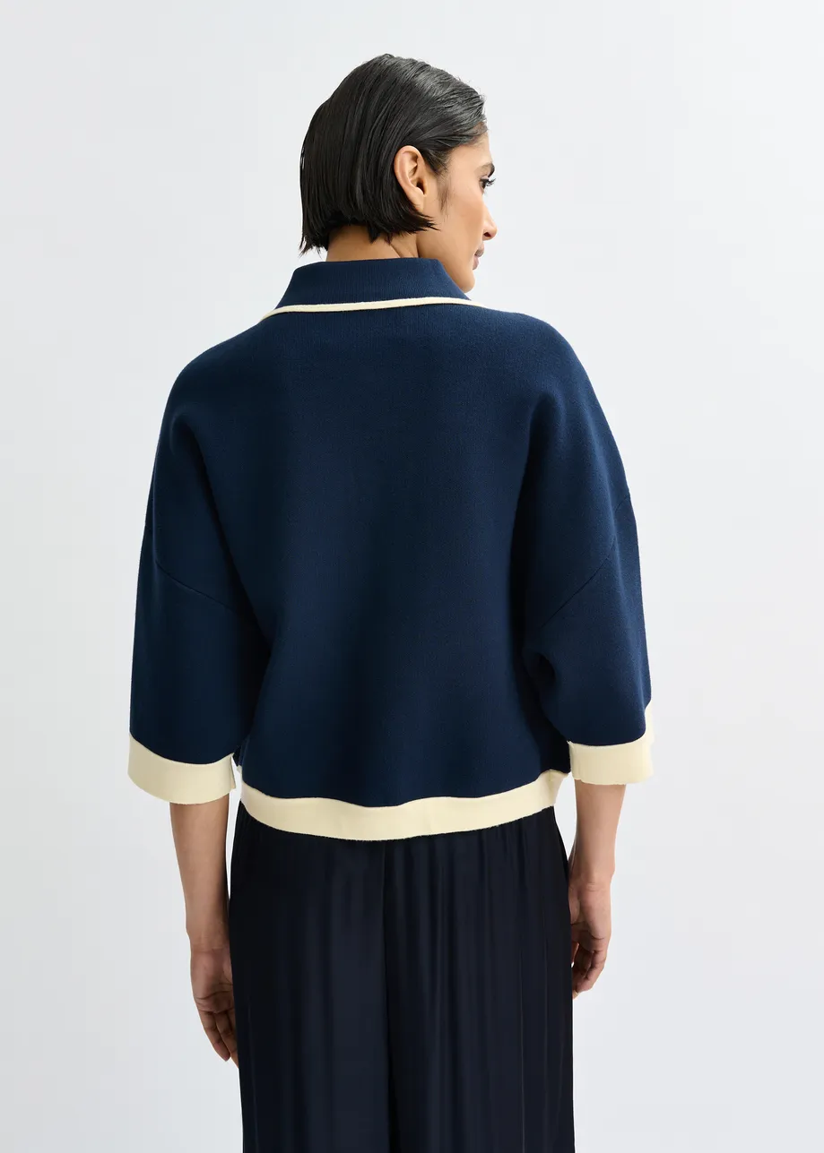 Navy knit cardigan with flower buttons and off-white contrasting trims