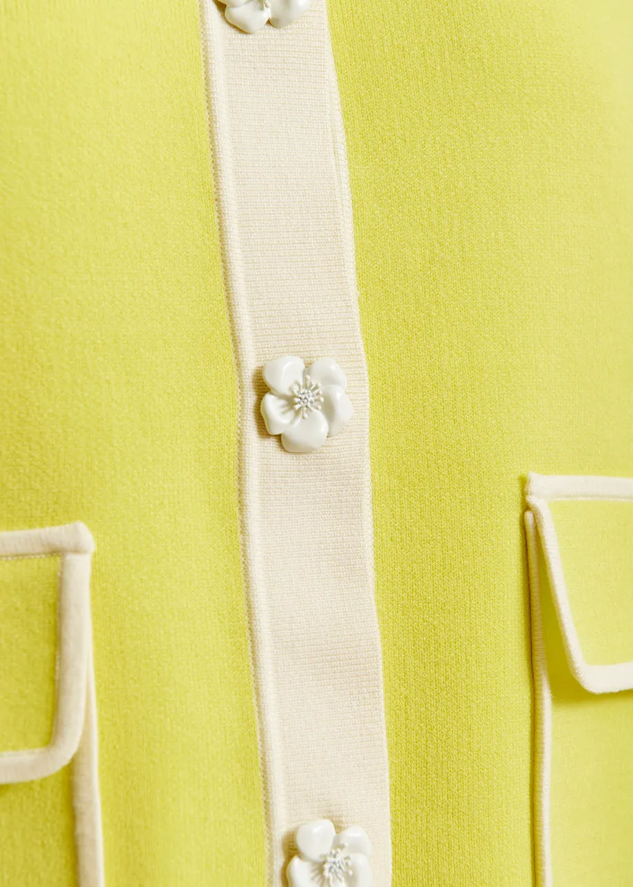 Yellow knit cardigan with flower buttons and off-white contrasting trims