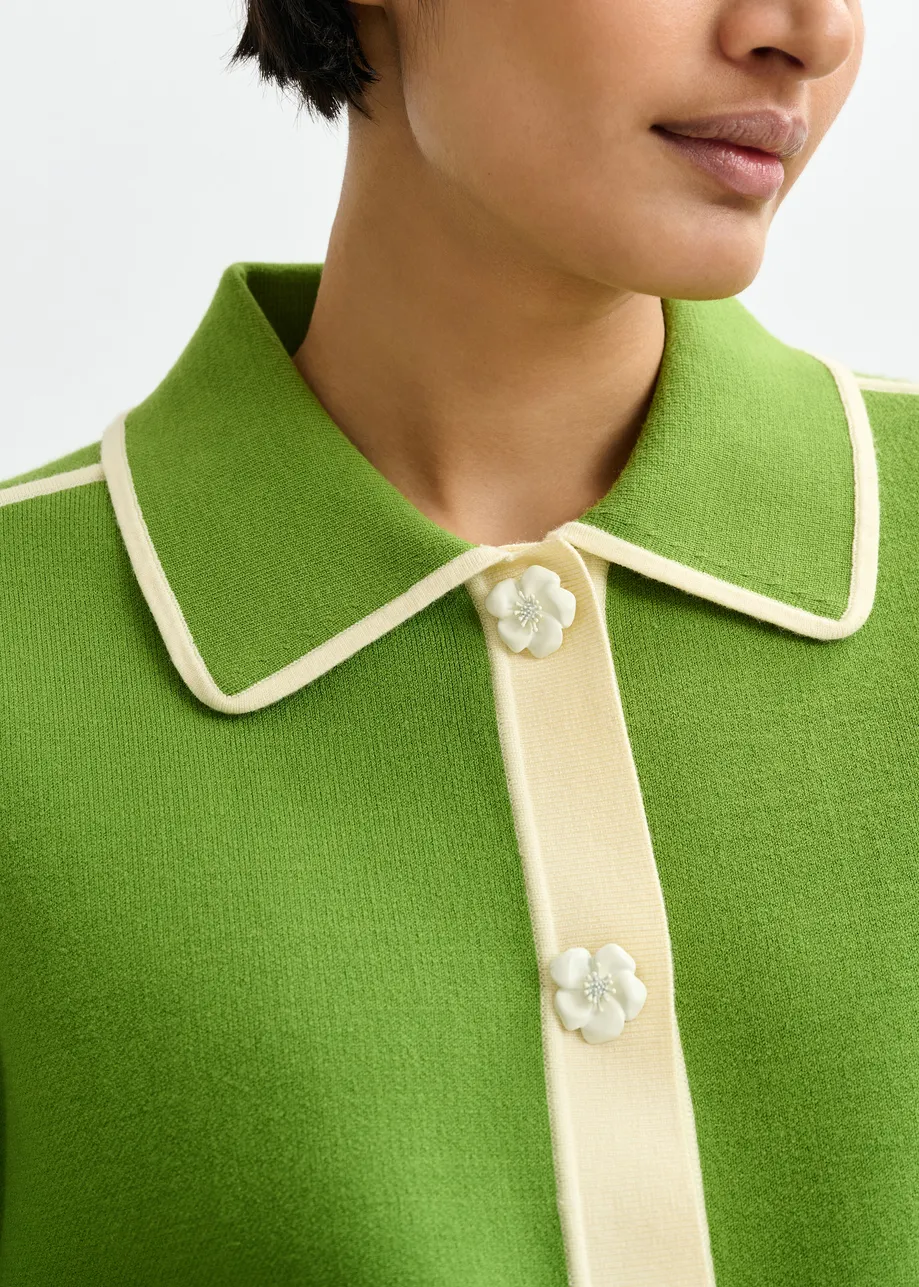 Green knit cardigan with flower buttons and off-white contrasting trims