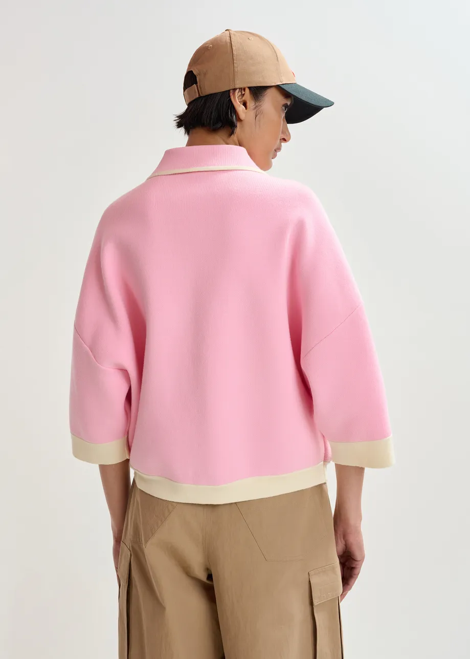 Pink knit cardigan with flower buttons and off-white contrasting trims