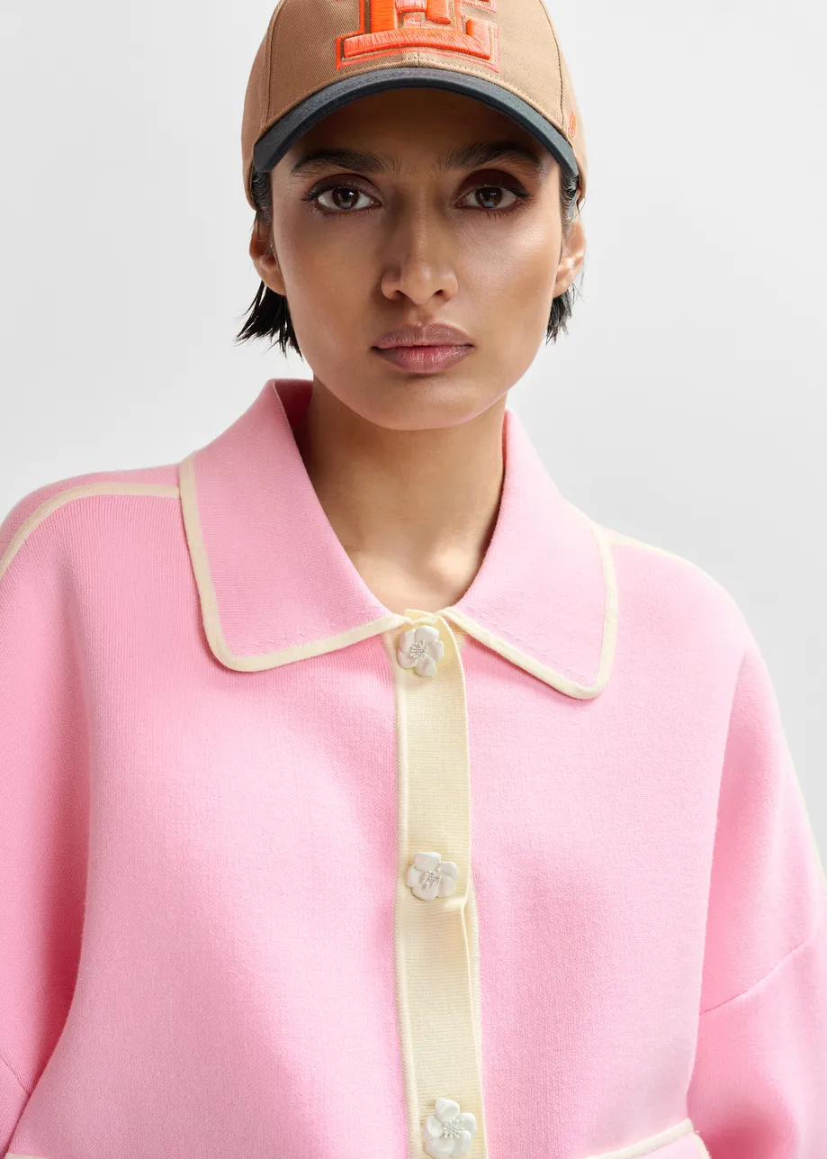 Pink knit cardigan with flower buttons and off-white contrasting trims