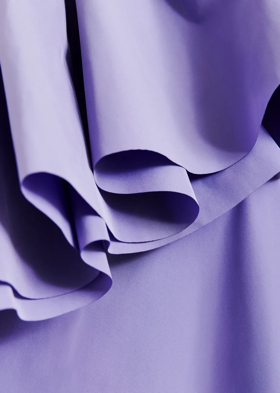 Purple one-shoulder mini dress with ruffle details