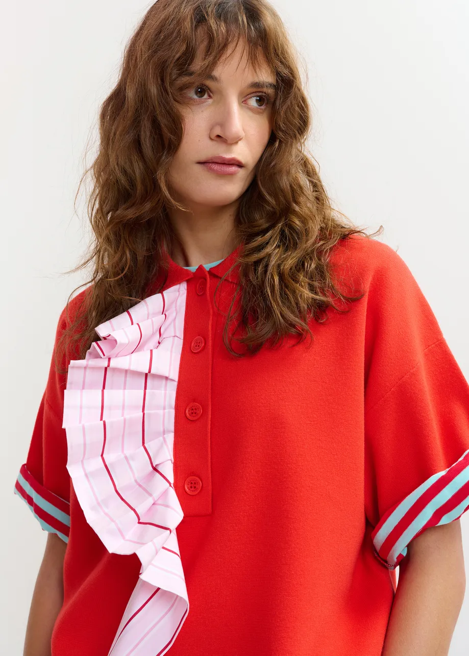 Oranje en lichtroze fijngebreide polo met volants