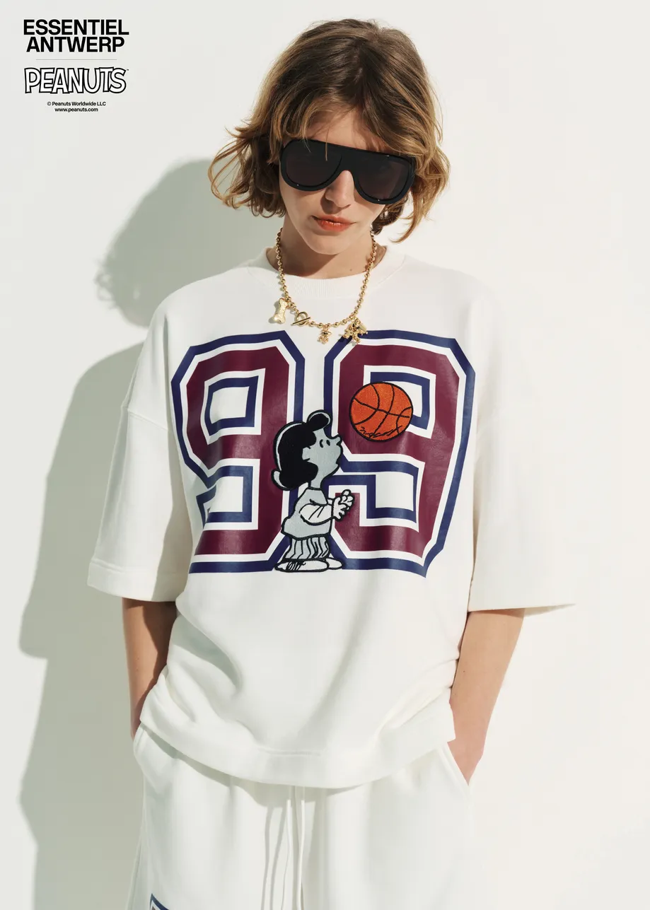 Off-white T-shirt with appliquéd Peanuts™ Lucy patch and text print