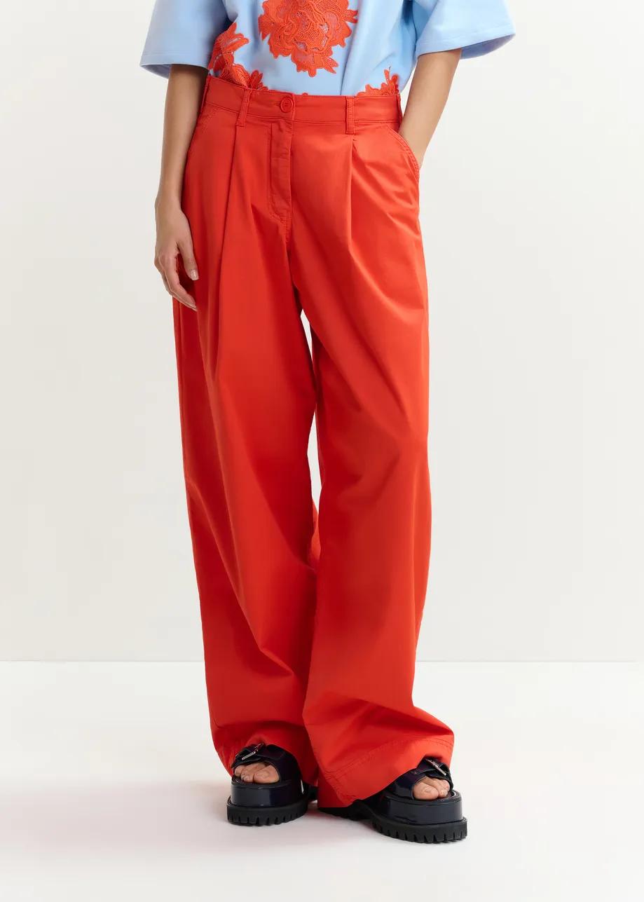 Orange pleated wide-leg pants