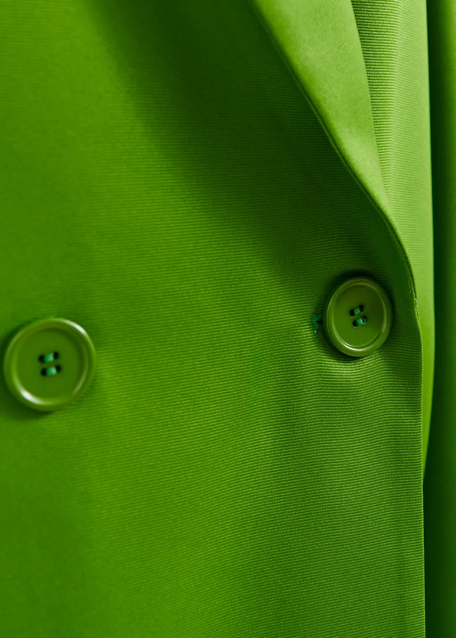 Groene mantel met dubbele knopenrij 