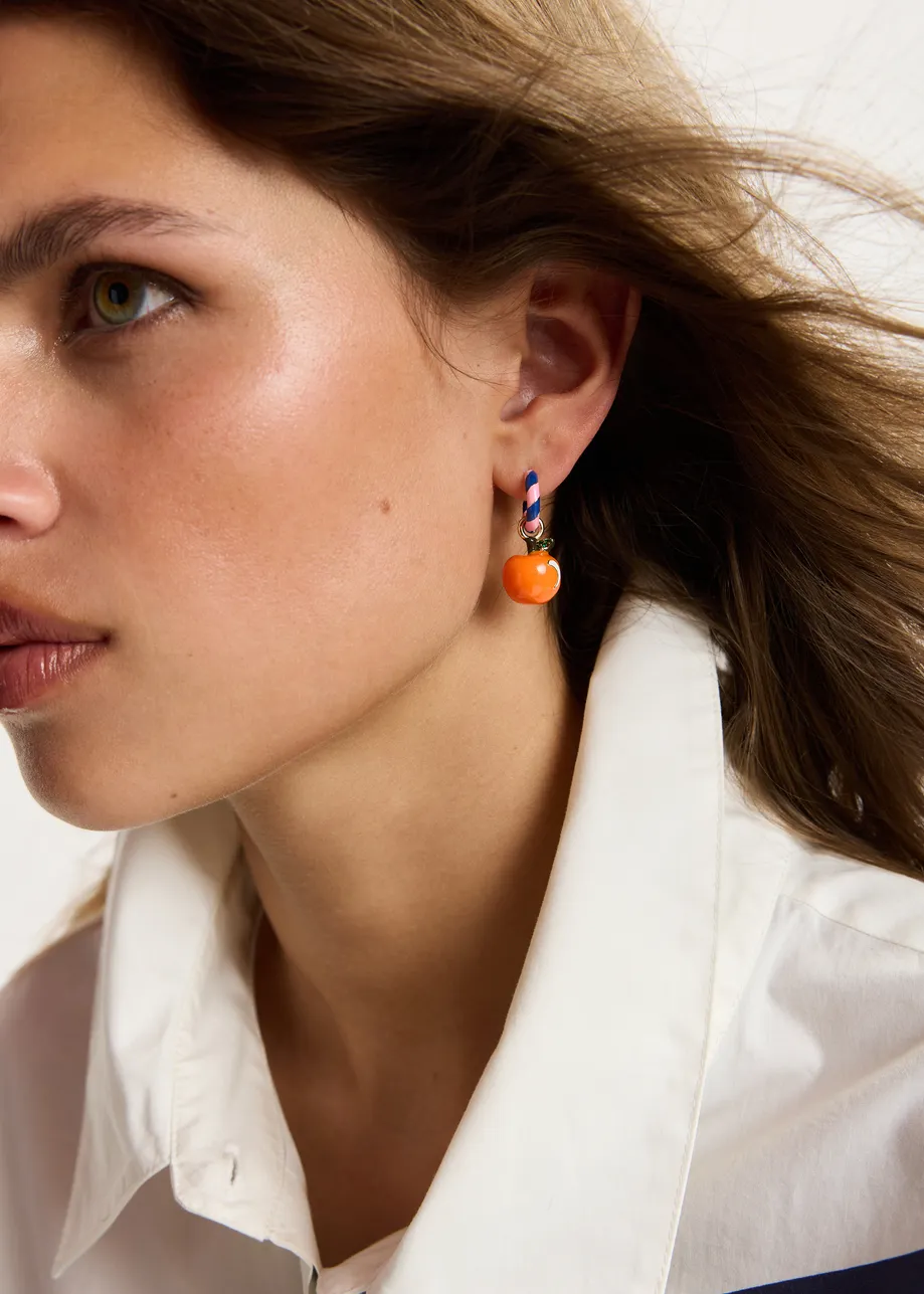 Pink and blue hoop earrings with dog and orange pendants