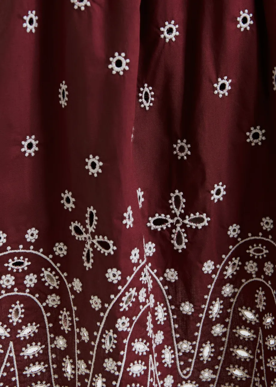 Dark red and white embroidered cotton skirt with scalloped hemline