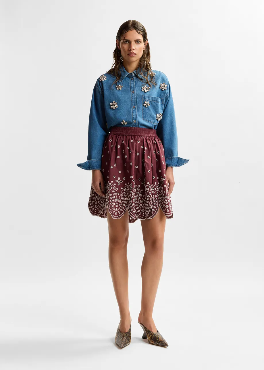 Dark red and white embroidered cotton skirt with scalloped hemline