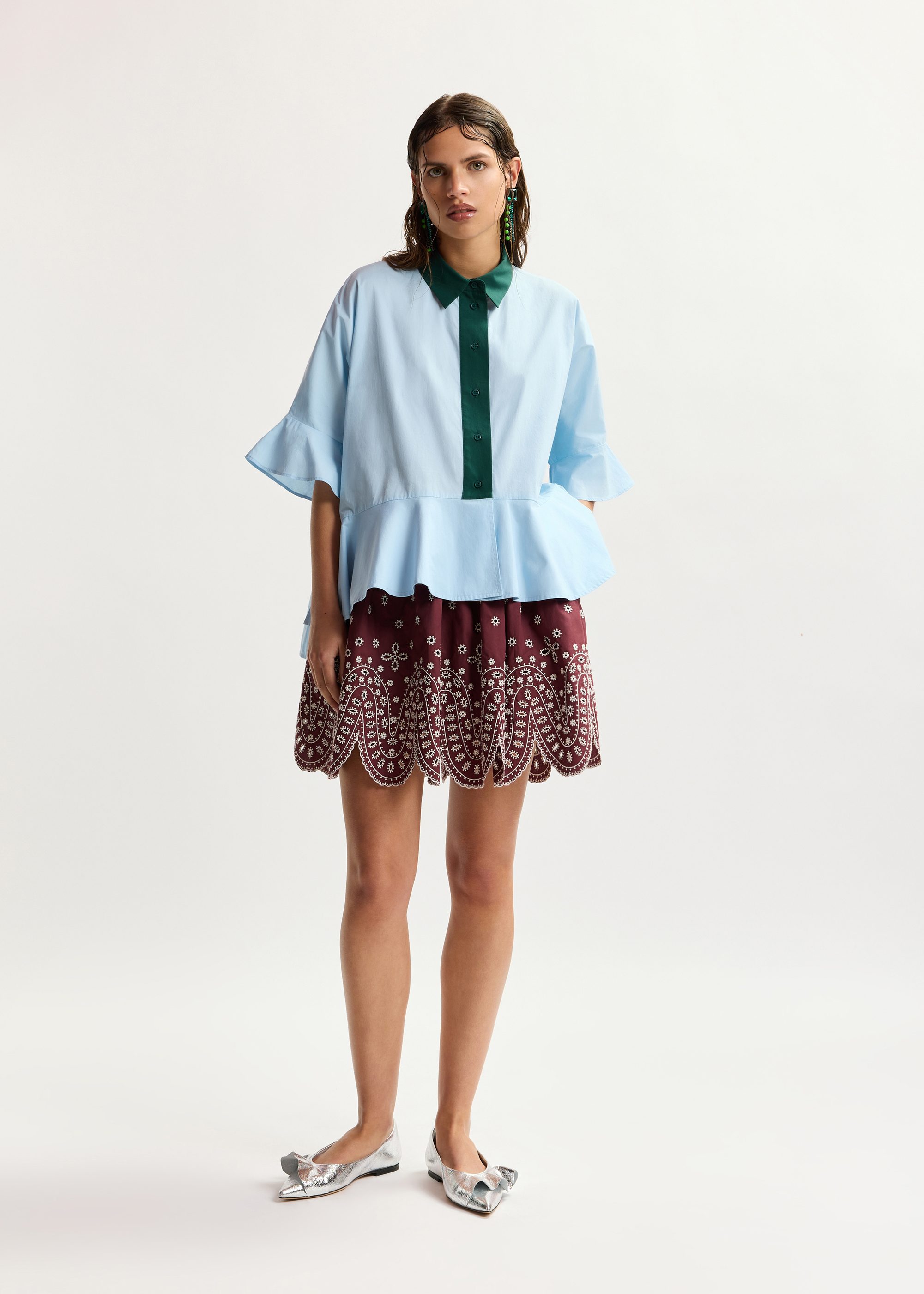 Light blue cotton peplum shirt with dark green contrast detailing