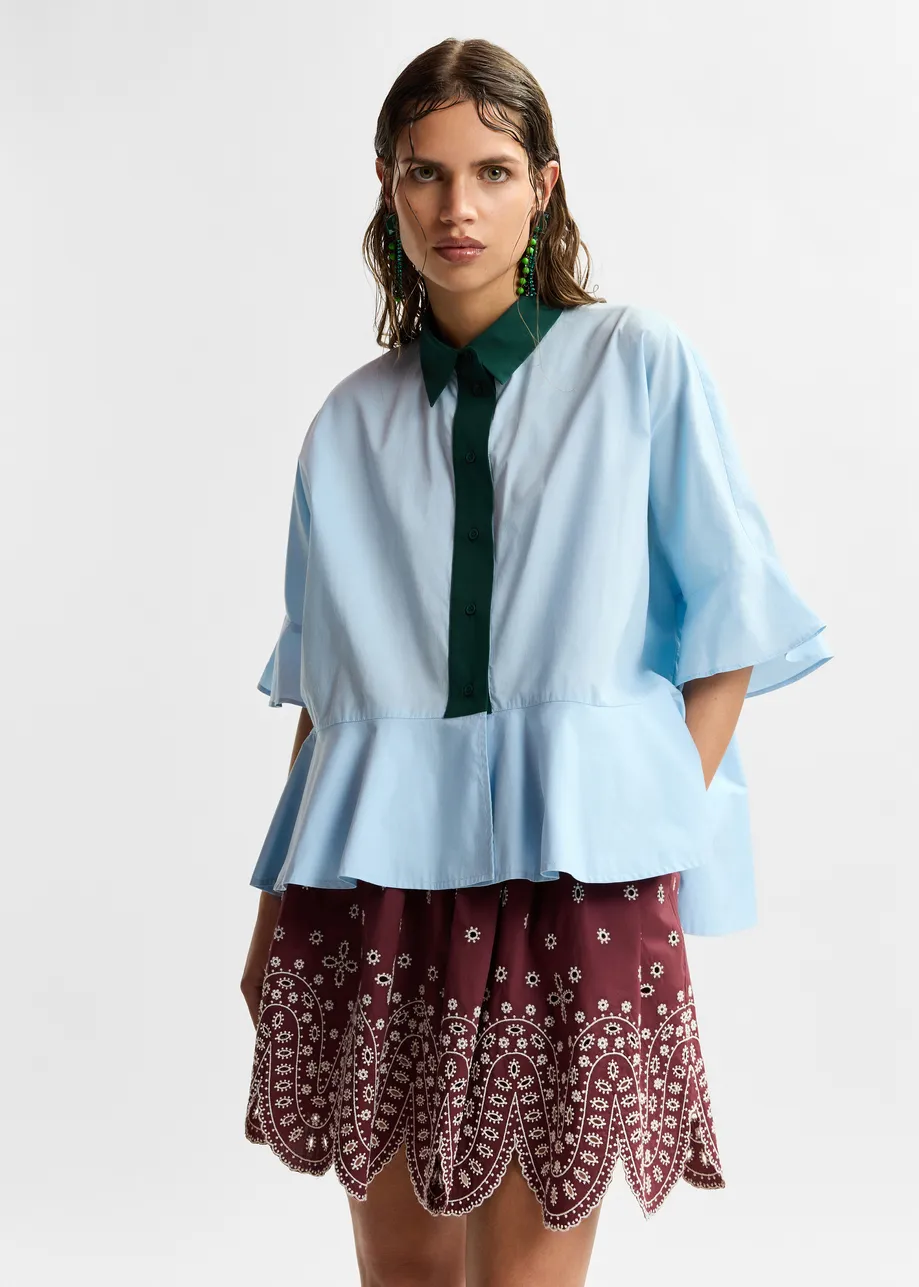 Light blue cotton peplum shirt with dark green contrast detailing