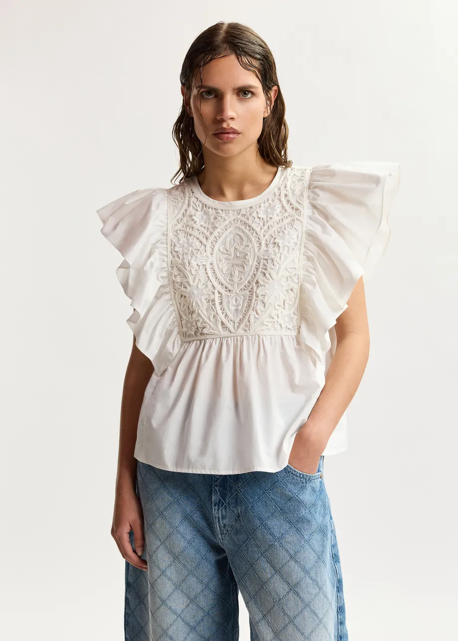 White cotton peplum top with lace-embroidered front and ruffled sleeves