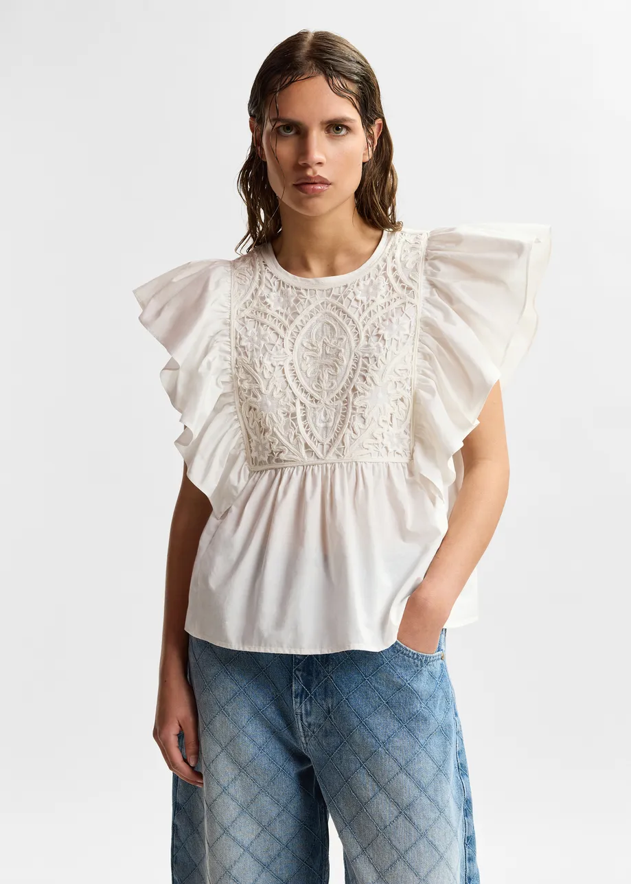 White cotton peplum top with lace-embroidered front and ruffled sleeves