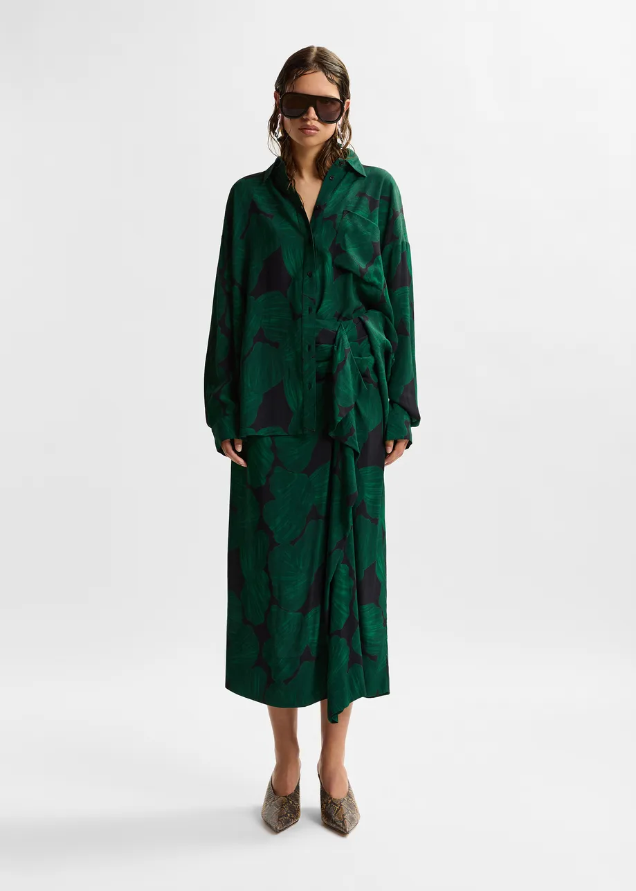 Dark green and black draped midi skirt with tropical print