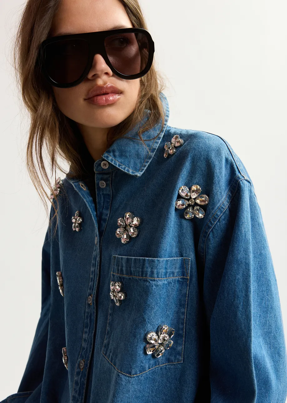 Blue denim shirt with floral rhinestone embellishments