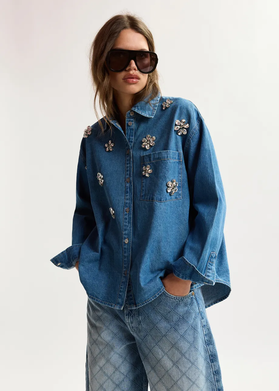 Blue denim shirt with floral rhinestone embellishments