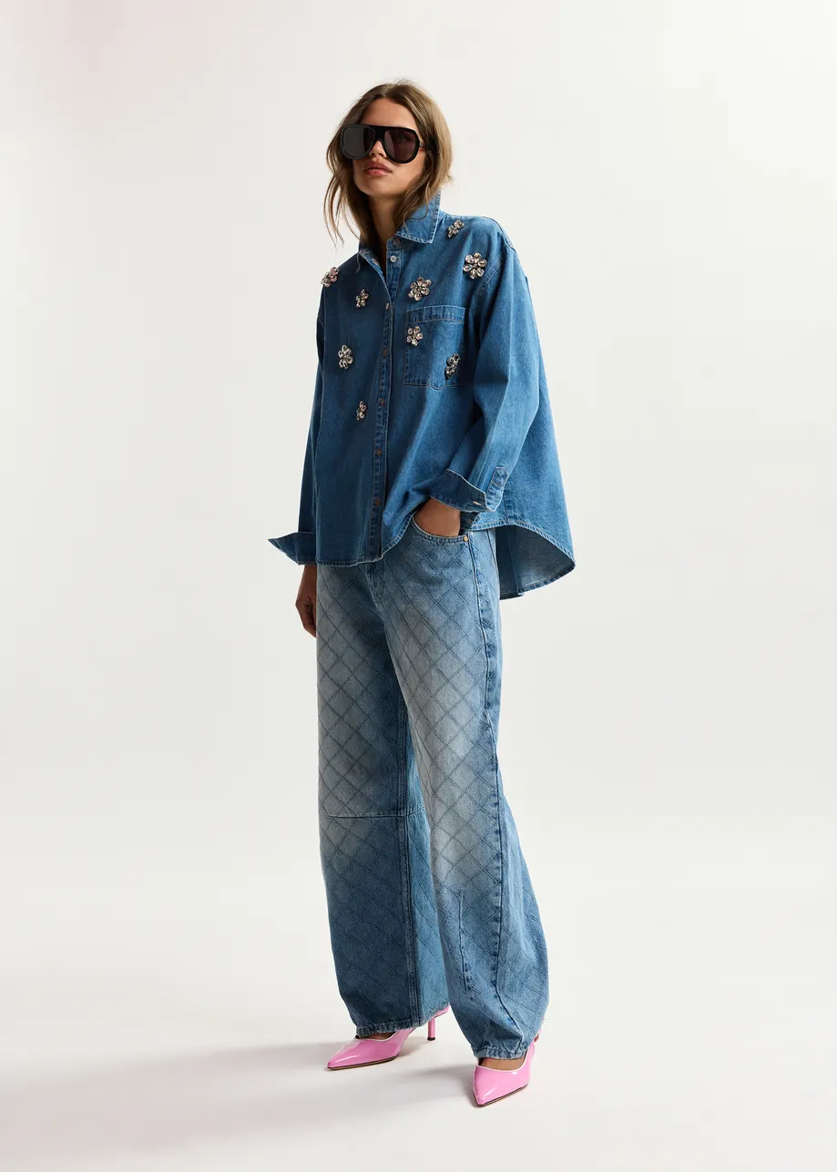 Blue denim shirt with floral rhinestone embellishments