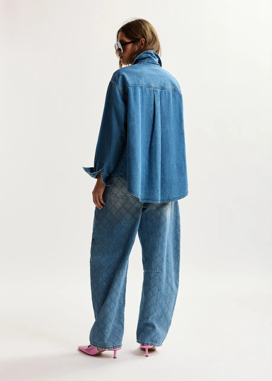 Blue denim shirt with floral rhinestone embellishments